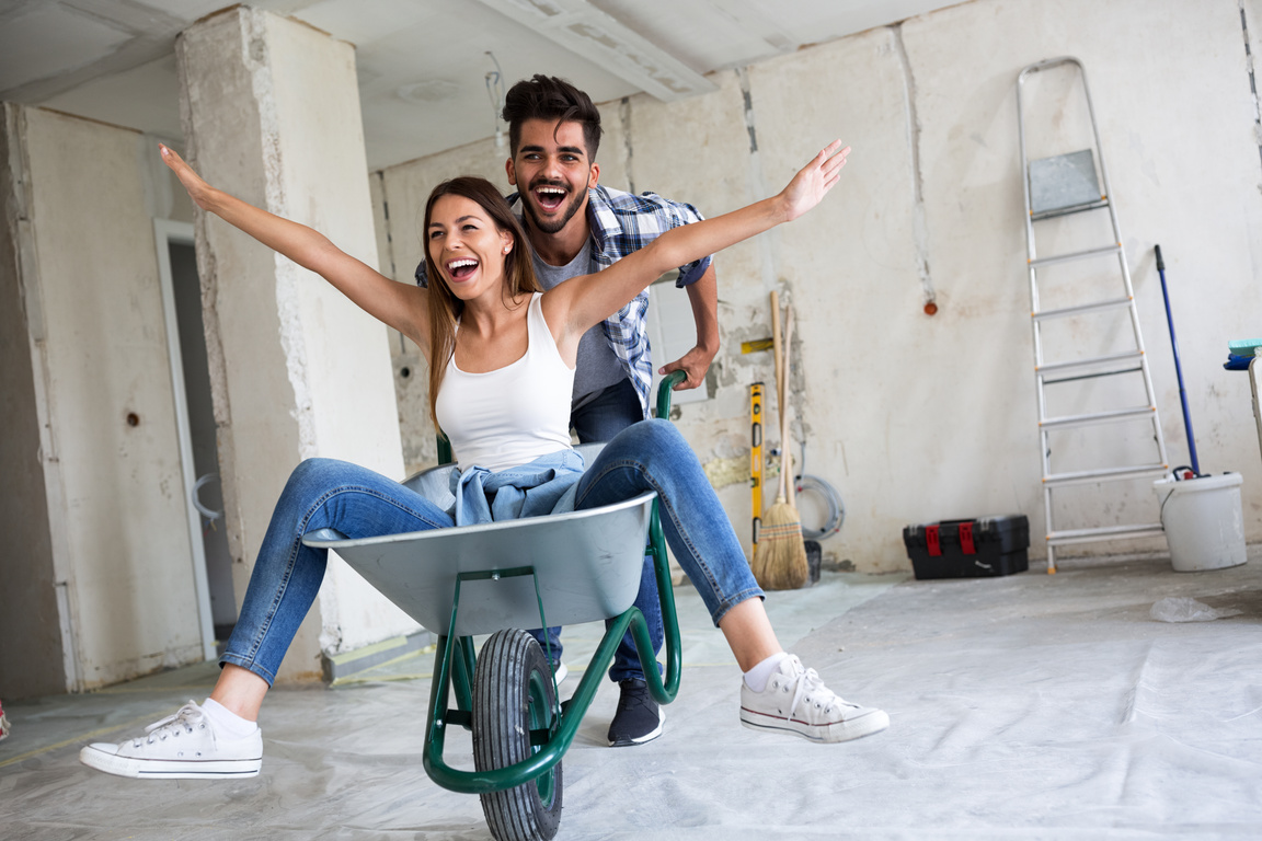 Loving couple is having fun while they are renovating house