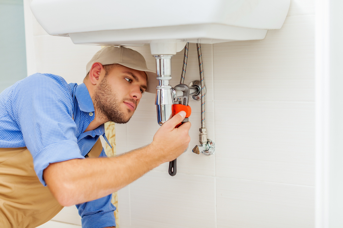 Man Repairing Sink